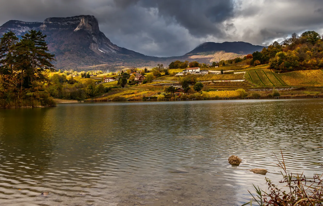 Photo wallpaper autumn, clouds, mountains, shore, houses, pine, pond, settlement