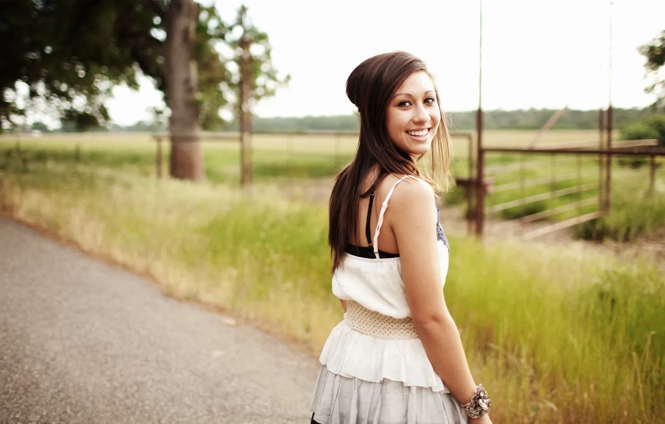 Photo wallpaper road, grass, look, girl, smile, brunette, Savanna