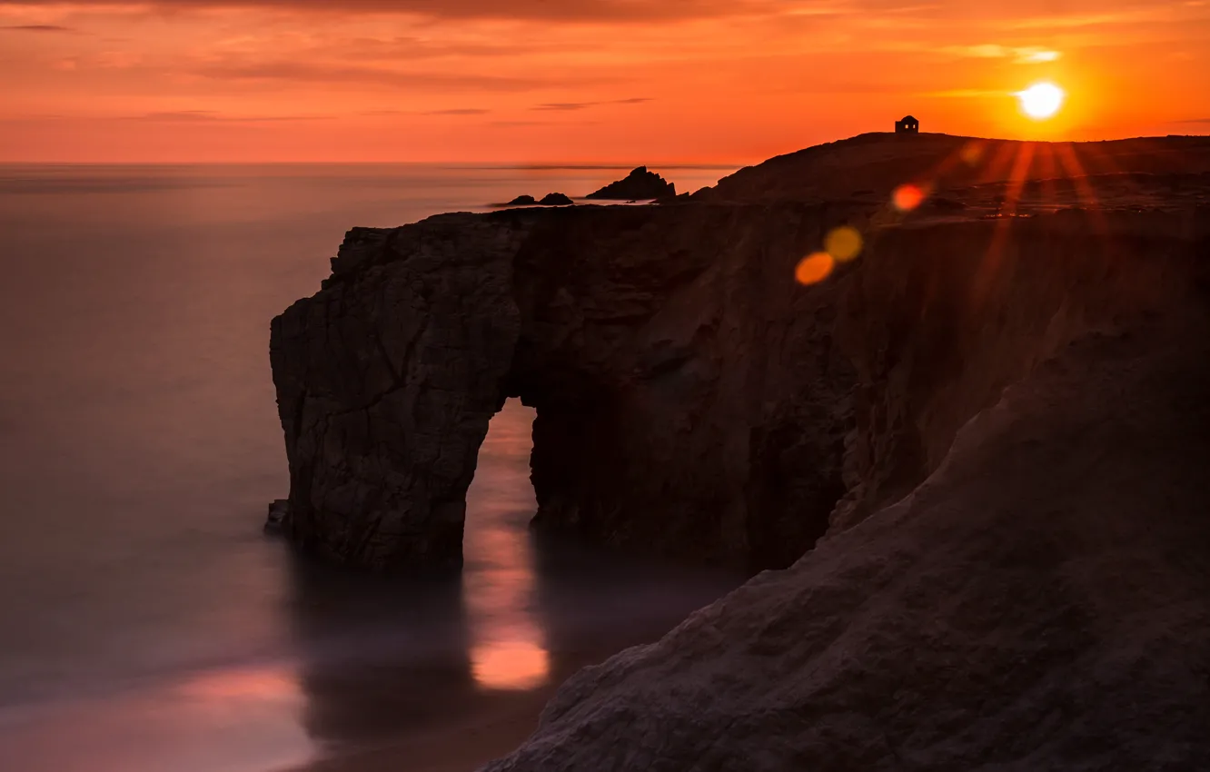 Photo wallpaper sea, the sky, the sun, rays, light, sunset, glare, rocks