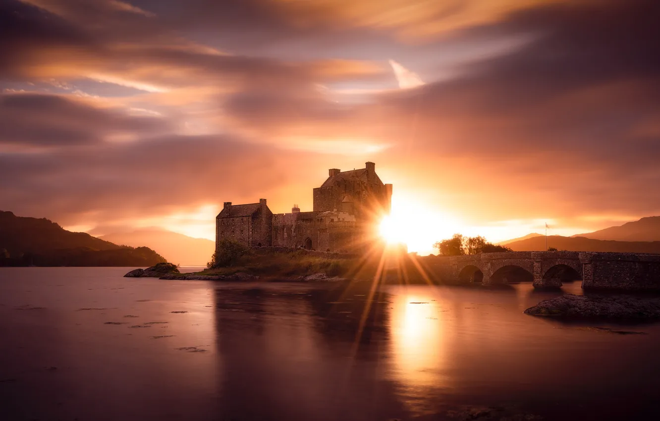 Photo wallpaper the sky, the sun, clouds, rays, light, sunset, mountains, bridge