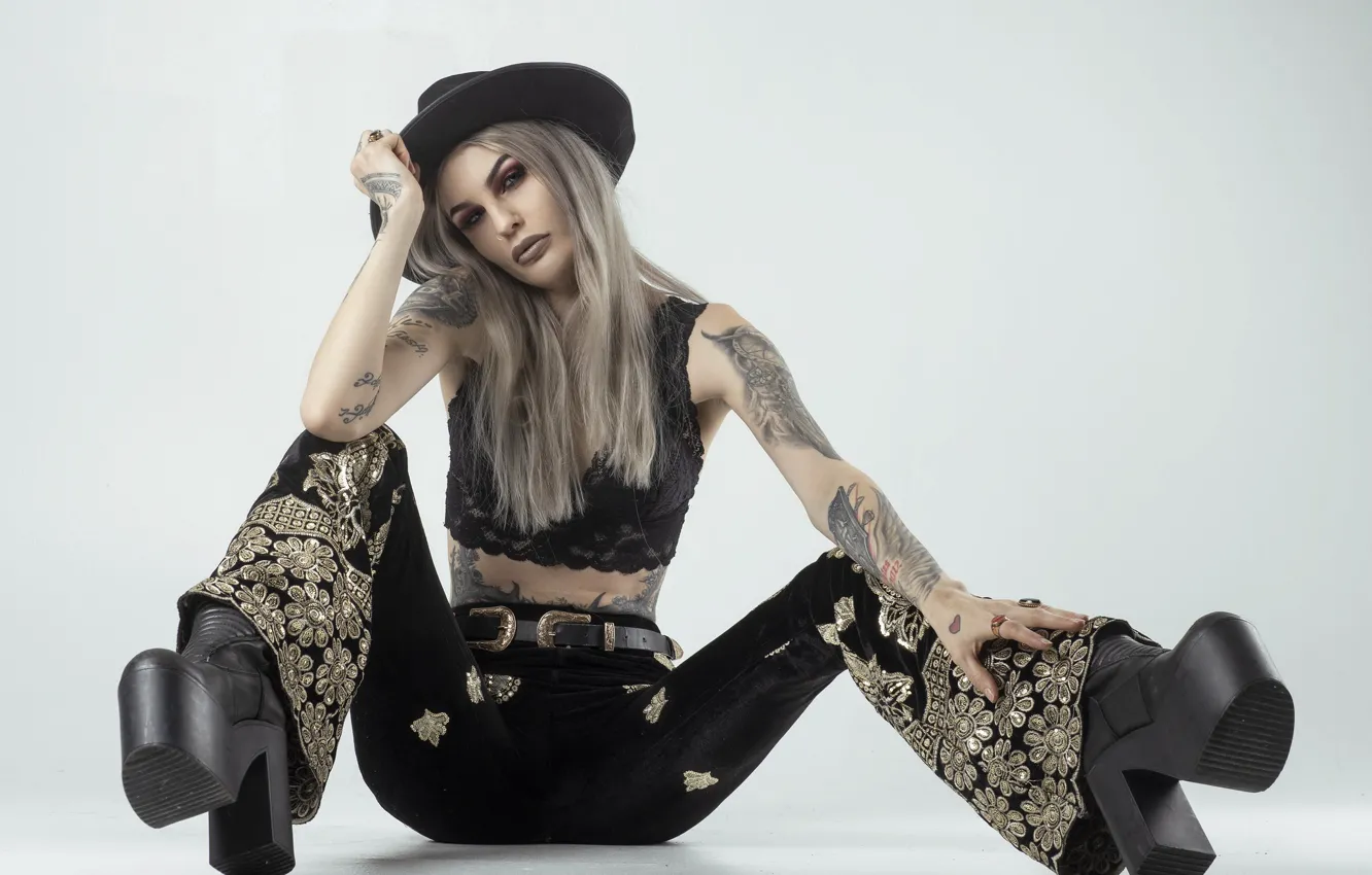 Photo wallpaper girl, face, style, boots, tattoo, sitting, pants