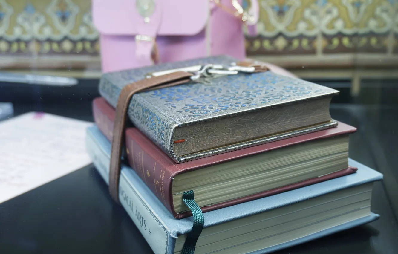 Photo wallpaper table, book, bag, a stack of books