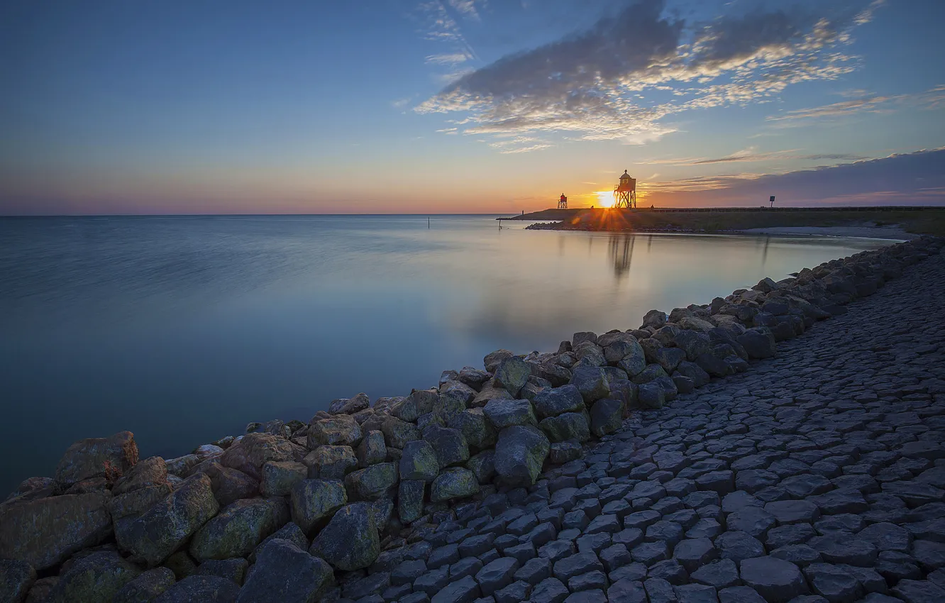 Photo wallpaper sunset, lake, stones, shore, lighthouse, Netherlands, Netherlands, the IJsselmeer