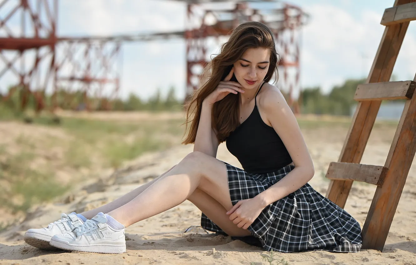 Photo wallpaper sand, girl, pose, skirt, hands, legs, long hair, sneakers