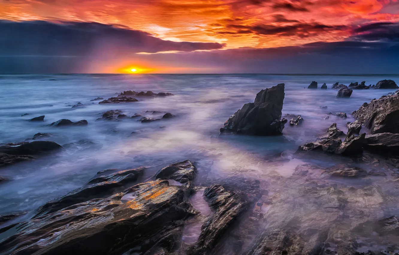 Photo wallpaper sea, the sun, clouds, sunset, clouds, stones, rocks, the bottom