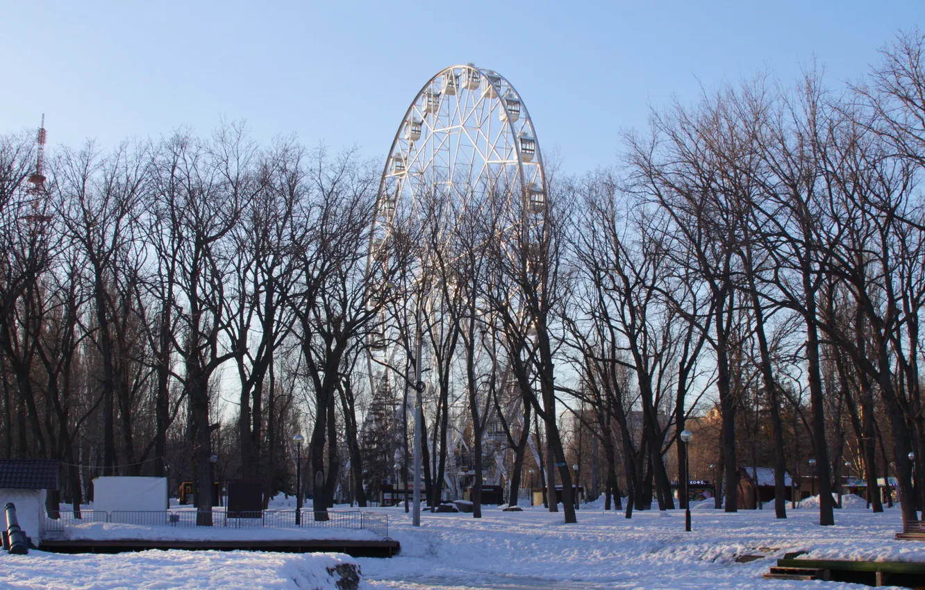 Photo wallpaper the sky, snow, trees, the city, spring, attraction, Ferris wheel, Russia