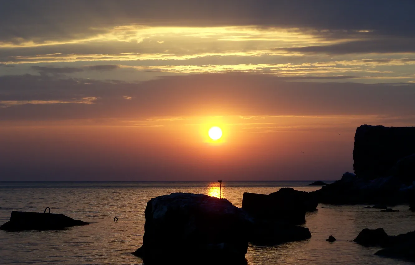 Photo wallpaper sea, water, the sun, sunset, surface, stones, calm