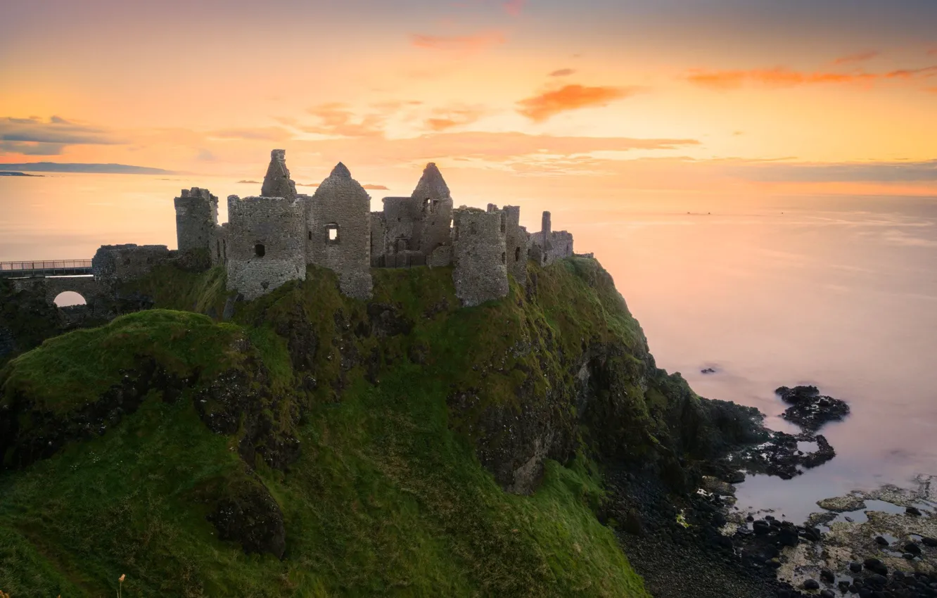 Photo wallpaper sea, the sky, clouds, sunset, Ireland, Dunluce Castle, medieval architecture, Dunluce сastle