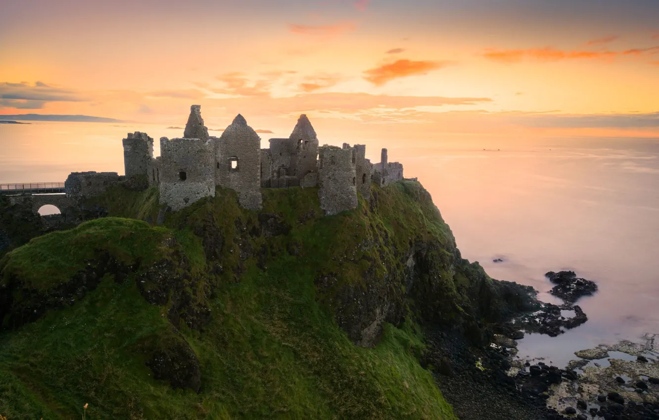 Photo wallpaper sea, the sky, clouds, sunset, Ireland, Dunluce castle, medieval architecture, Dunluce сastle