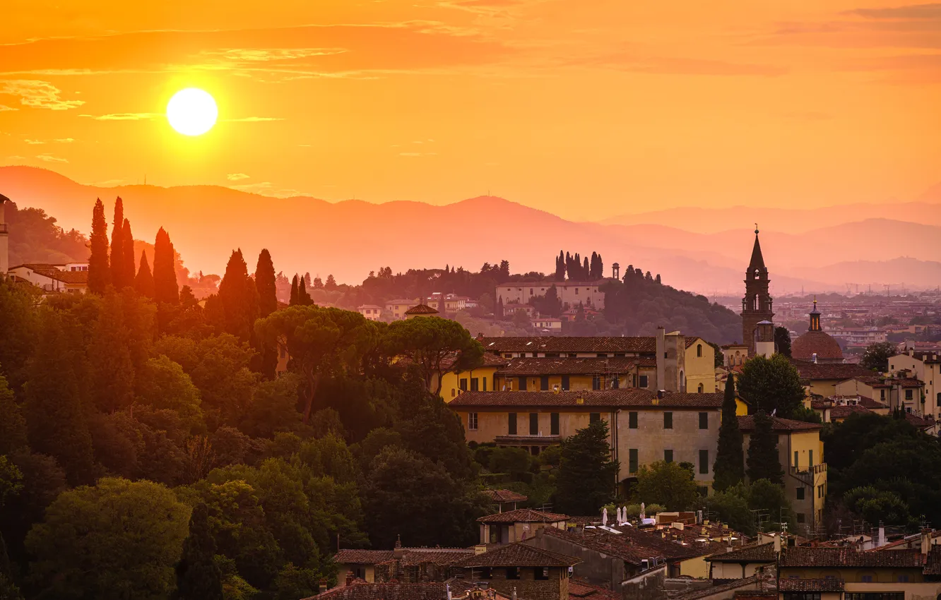 Photo wallpaper the sun, clouds, light, trees, mountains, the city, fog, dawn