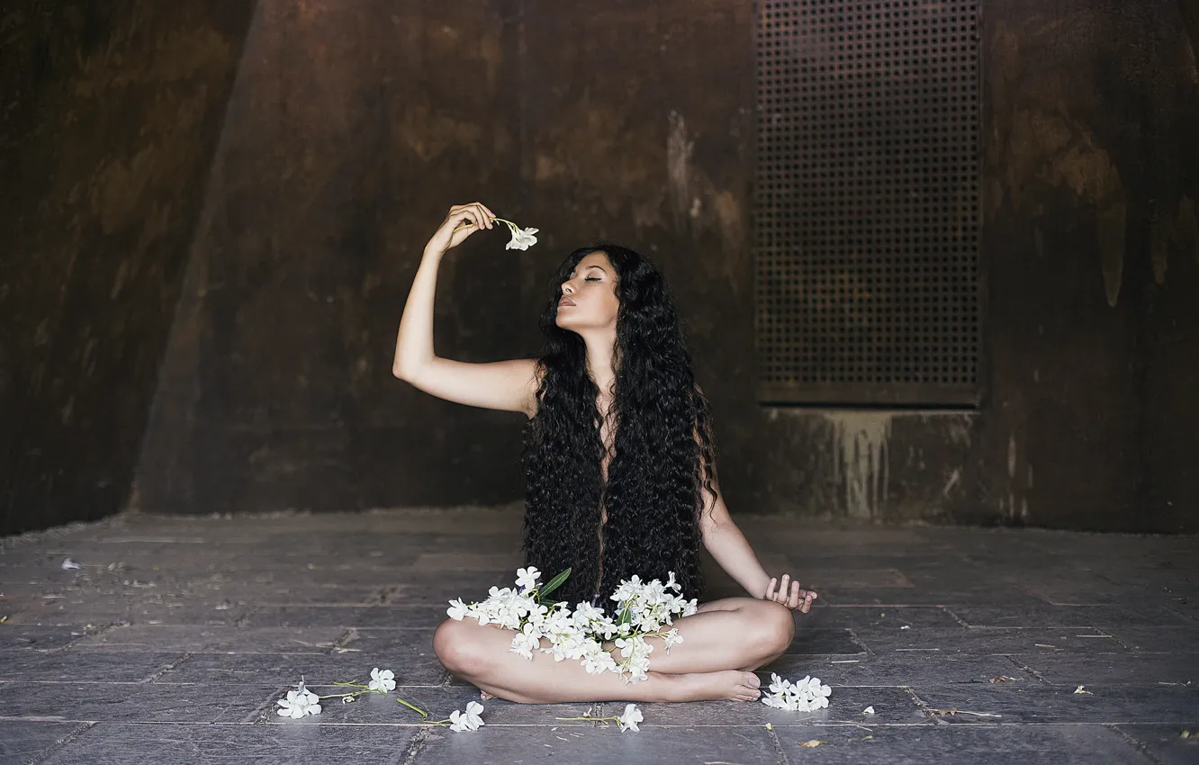 Photo wallpaper girl, flowers, face, hair, brunette, sitting, curls