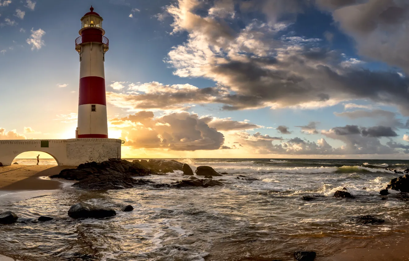 Photo wallpaper sea, the sky, the sun, clouds, stones, dawn, coast, lighthouse