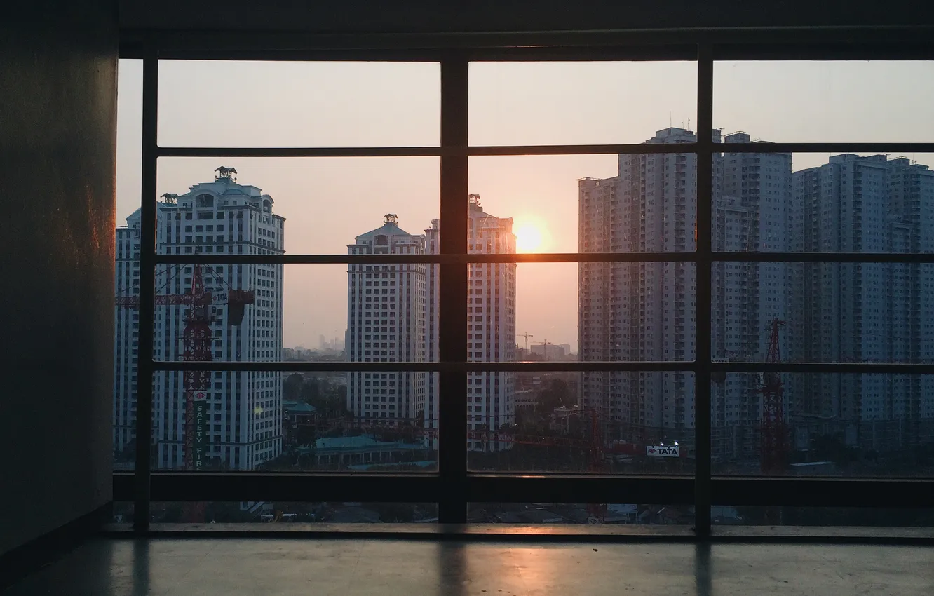 Photo wallpaper the sky, the sun, sunset, the city, building, horizon, glow, the view from the window