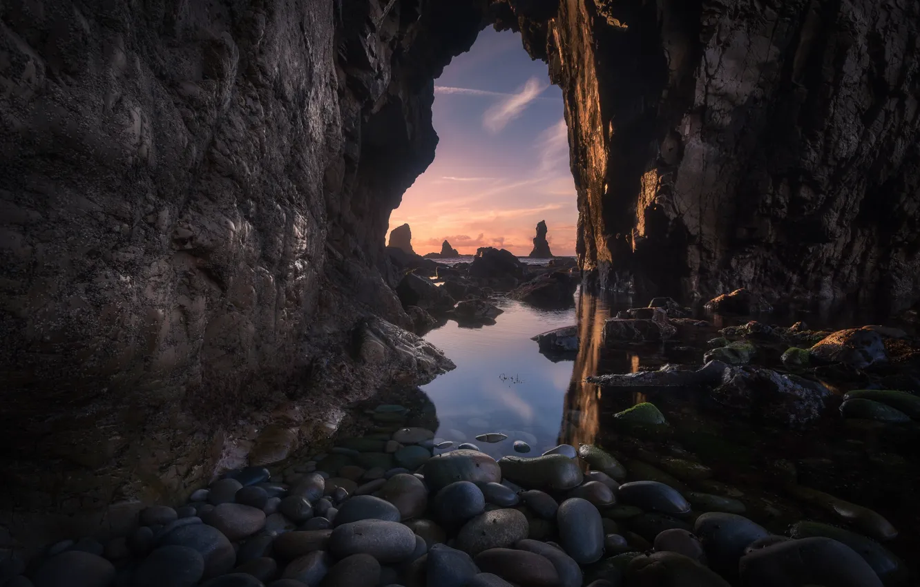 Photo wallpaper sea, sunset, pebbles, stones, rocks, shore, arch, cave