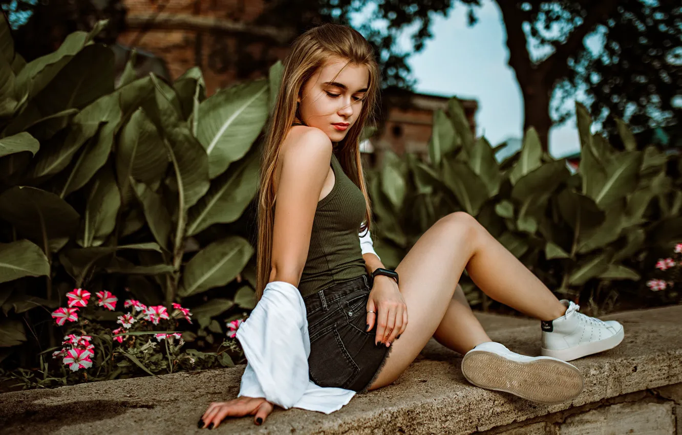 Photo wallpaper leaves, trees, flowers, pose, model, shorts, sneakers, portrait