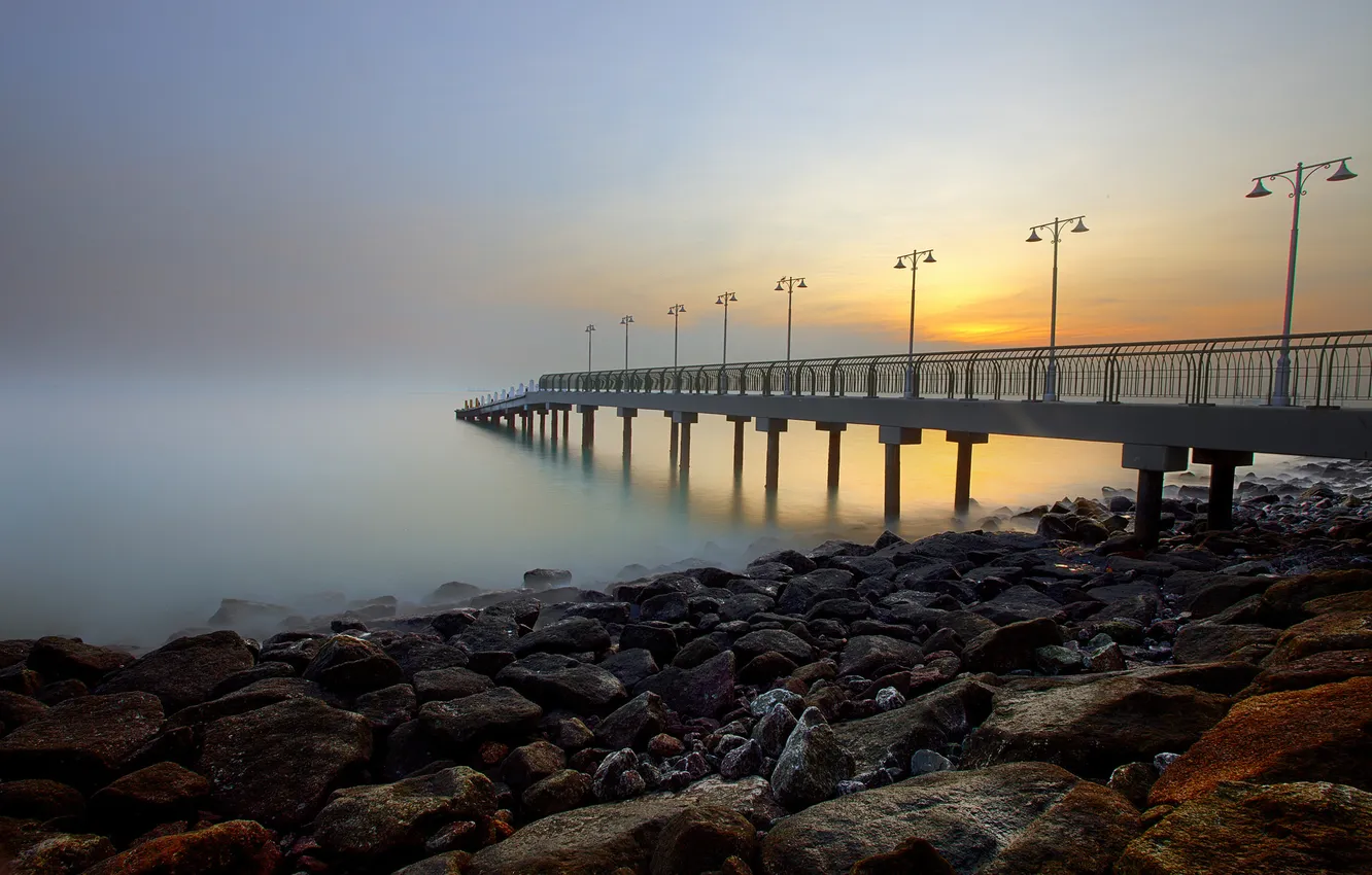 Photo wallpaper sea, the sky, sunset, fog, stones, shore, lights, pierce