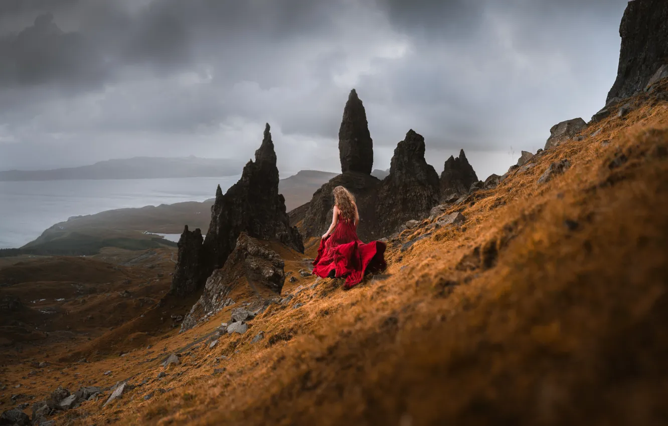 Photo wallpaper sea, girl, clouds, mountains, pose, fog, stones, overcast