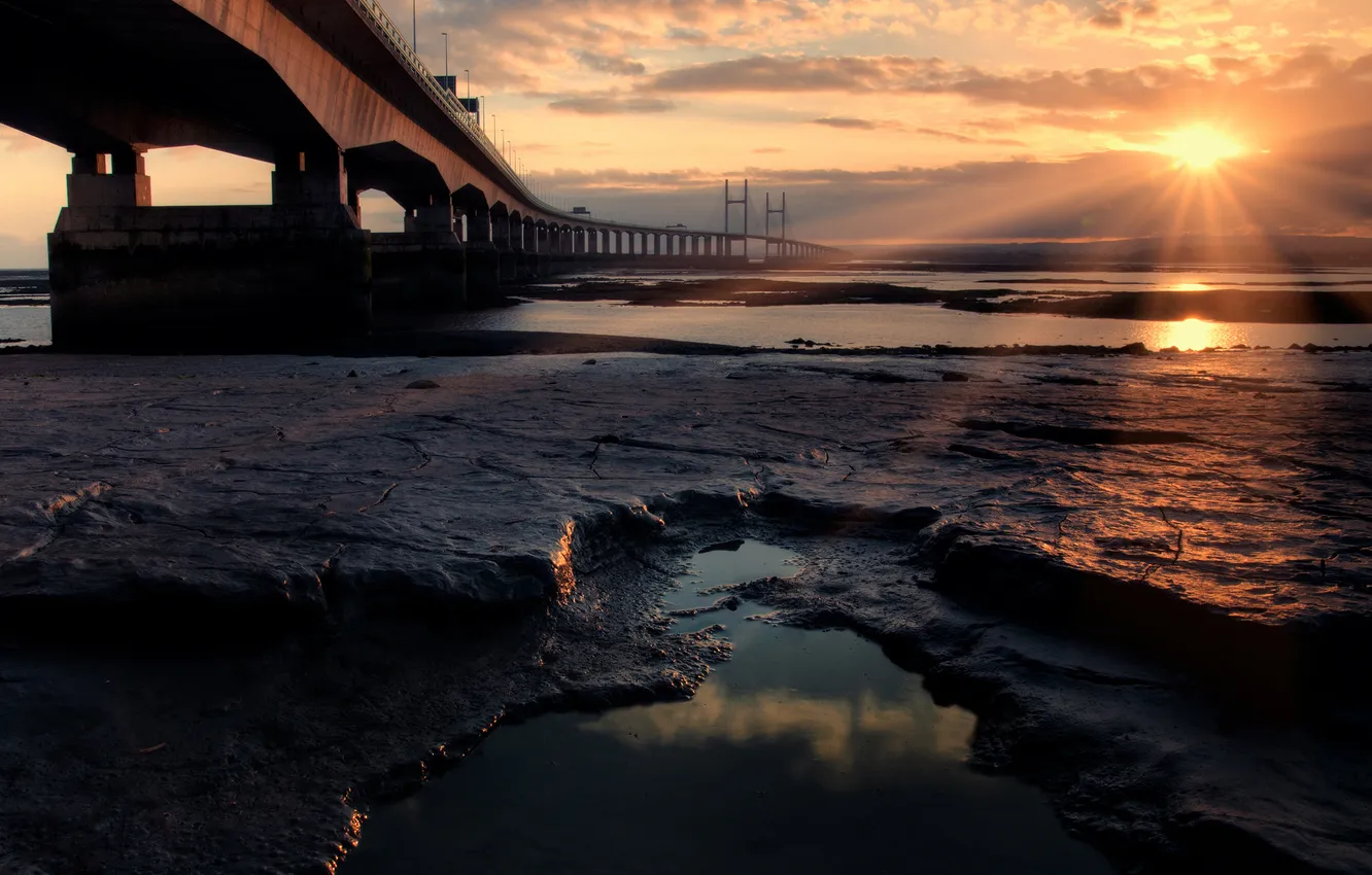 Photo wallpaper sea, the sun, rays, bridge, stones, the ocean, shore