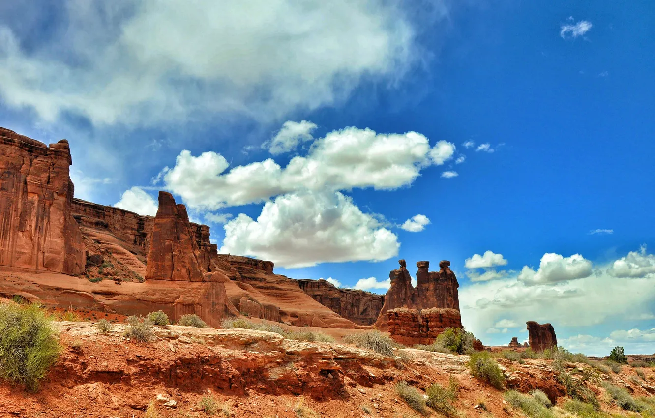 Photo wallpaper the sky, clouds, mountains, stones, rocks, USA, the bushes, Arches National Park
