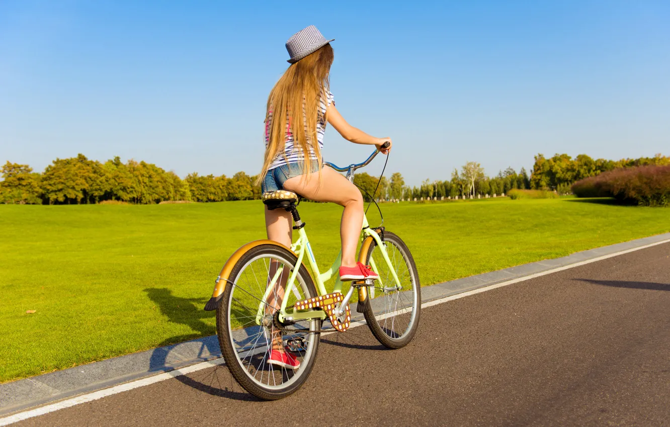 Photo wallpaper Girl, grass, bicycle, road, shorts, sky, long hair, legs