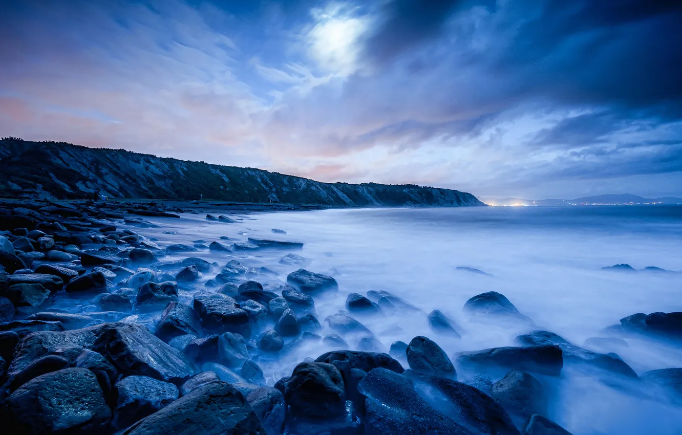 Photo wallpaper sea, clouds, night, lights, stones, the moon, shore