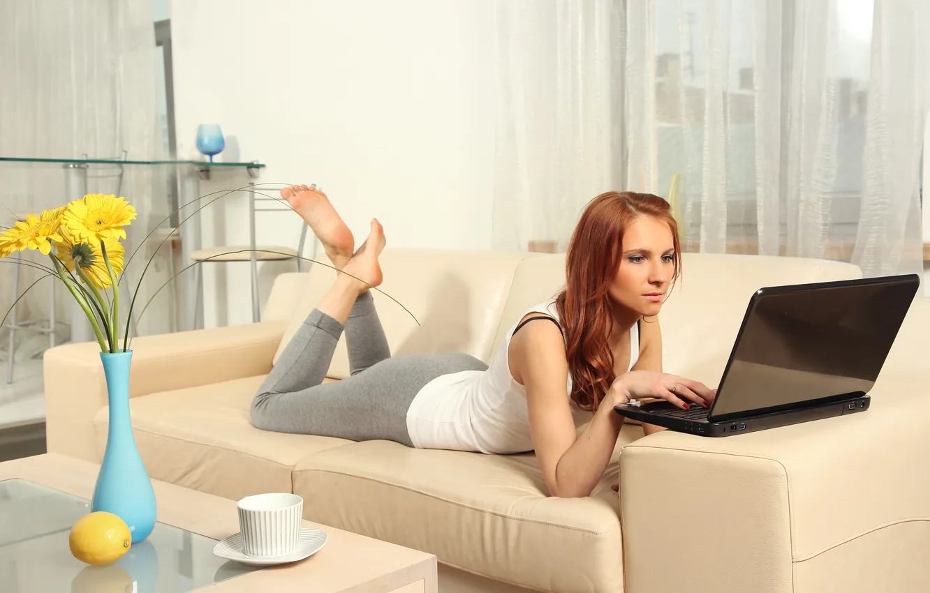 Photo wallpaper girl, flowers, room, sofa, lemon, vase, laptop, red