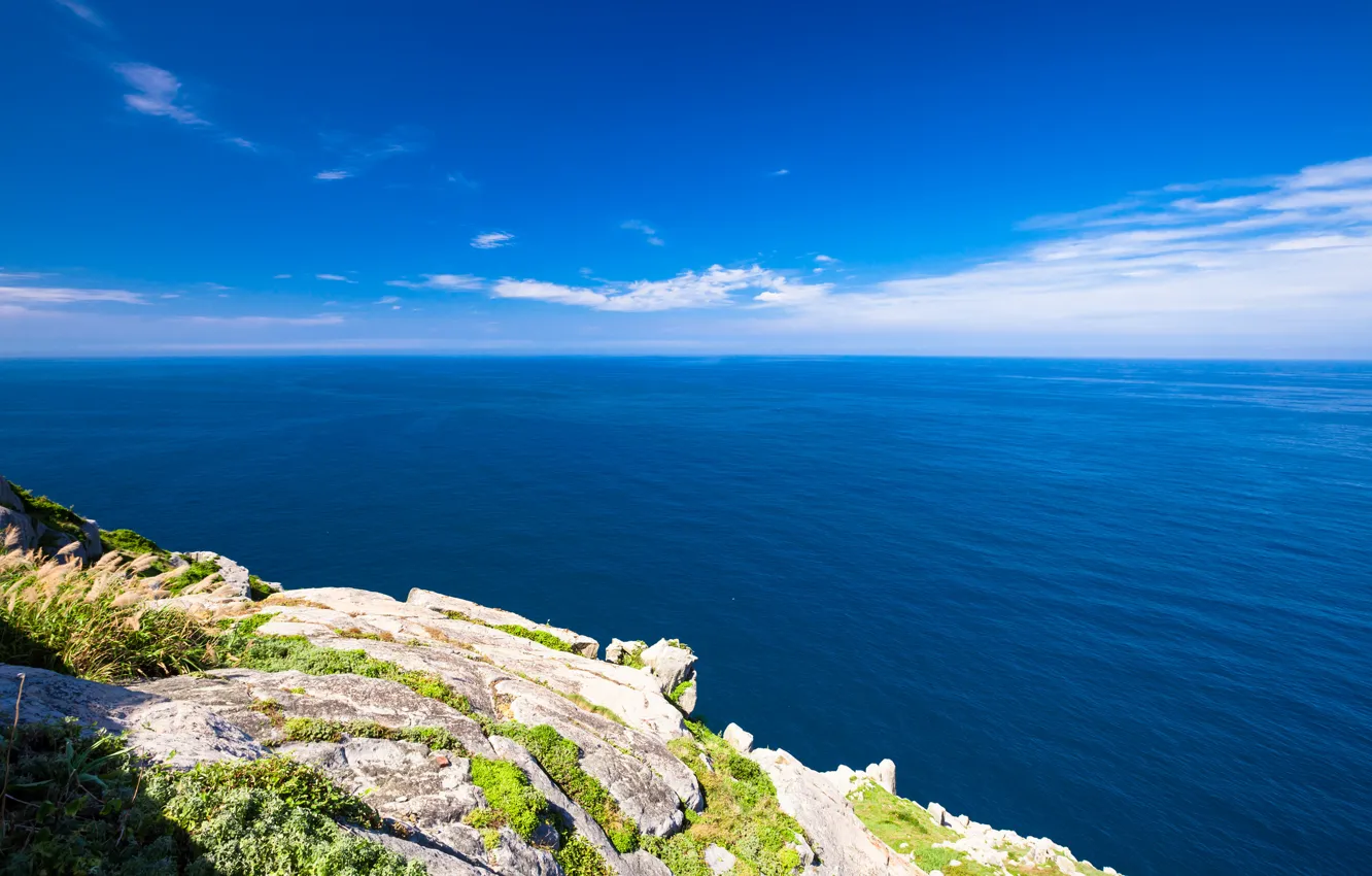 Photo wallpaper the sky, grass, stones, the ocean, rocks, horizon