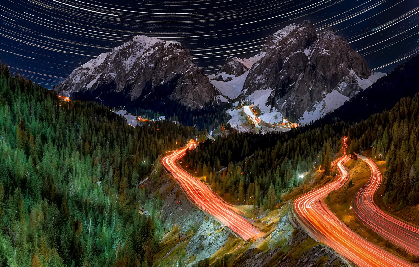 Photo wallpaper road, forest, snow, mountains, night, lights, movement, rocks